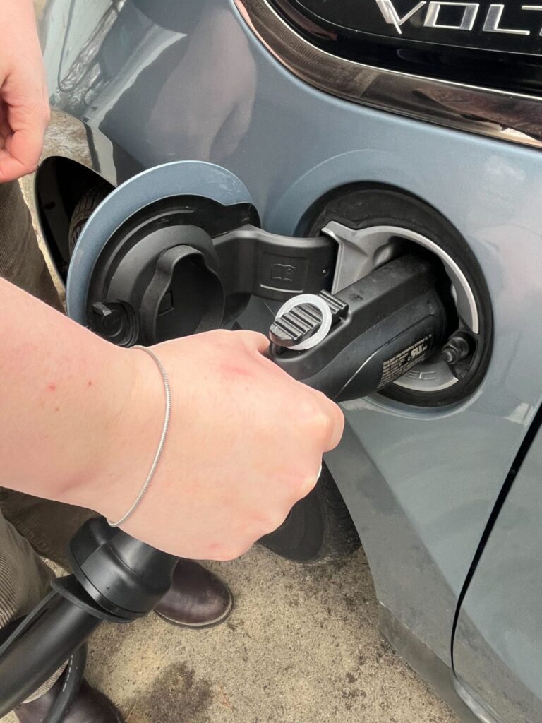 Thea Clarkberg, Earlham’s assistant director of admissions, charging her hybrid electric car.