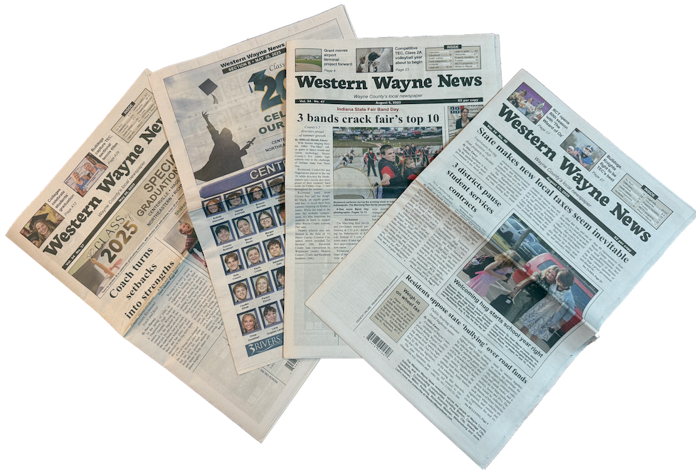 A photo of several recent print editions of the Western Wayne News