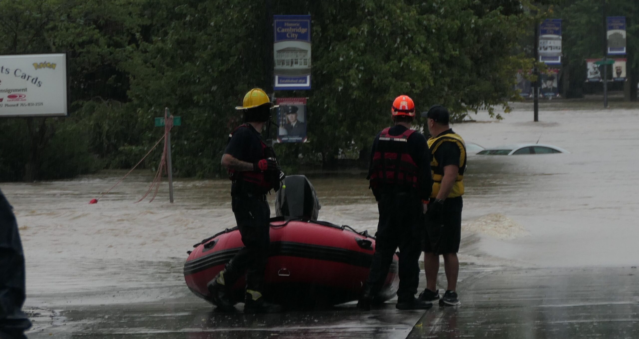 RFD boat torn, vehicle submerged in flooding
